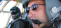 CC-130 Hercules pilots, Captain John Gelinas (foreground) and Captain Sylvio Roy, are seen in the cockpit prior to making a final approach into Kabul International Airport. The Canadian transport was delivering troops and supplies to the Afghan capital for Operation ATHENA, Canada's contribution to the International Security Assistance Force (ISAF).  <p><p>

Credit:  Sgt Frank Hudec/Canadian Forces Combat Camera